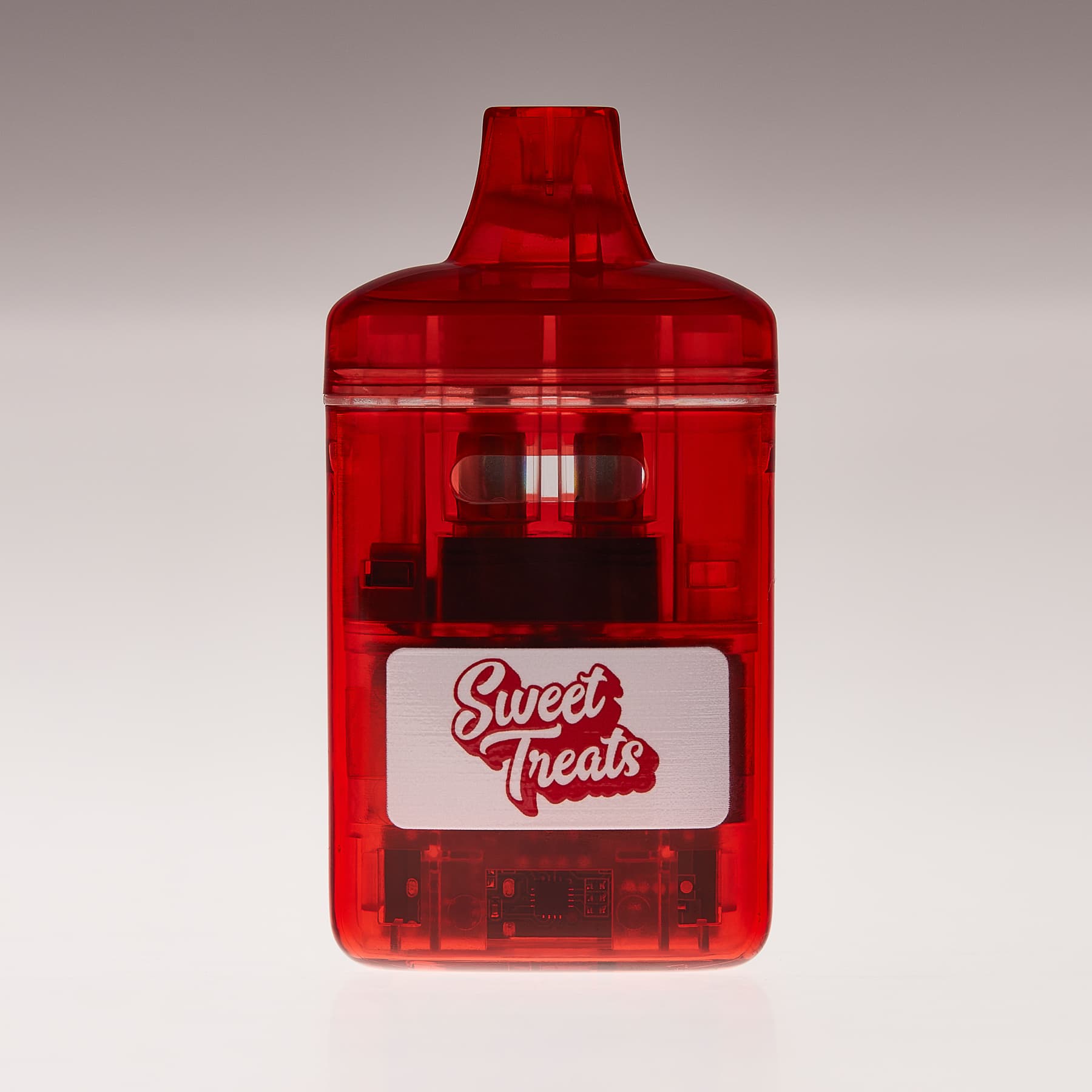 Translucent red XL vape with Sweet Treats label showing internal hardware