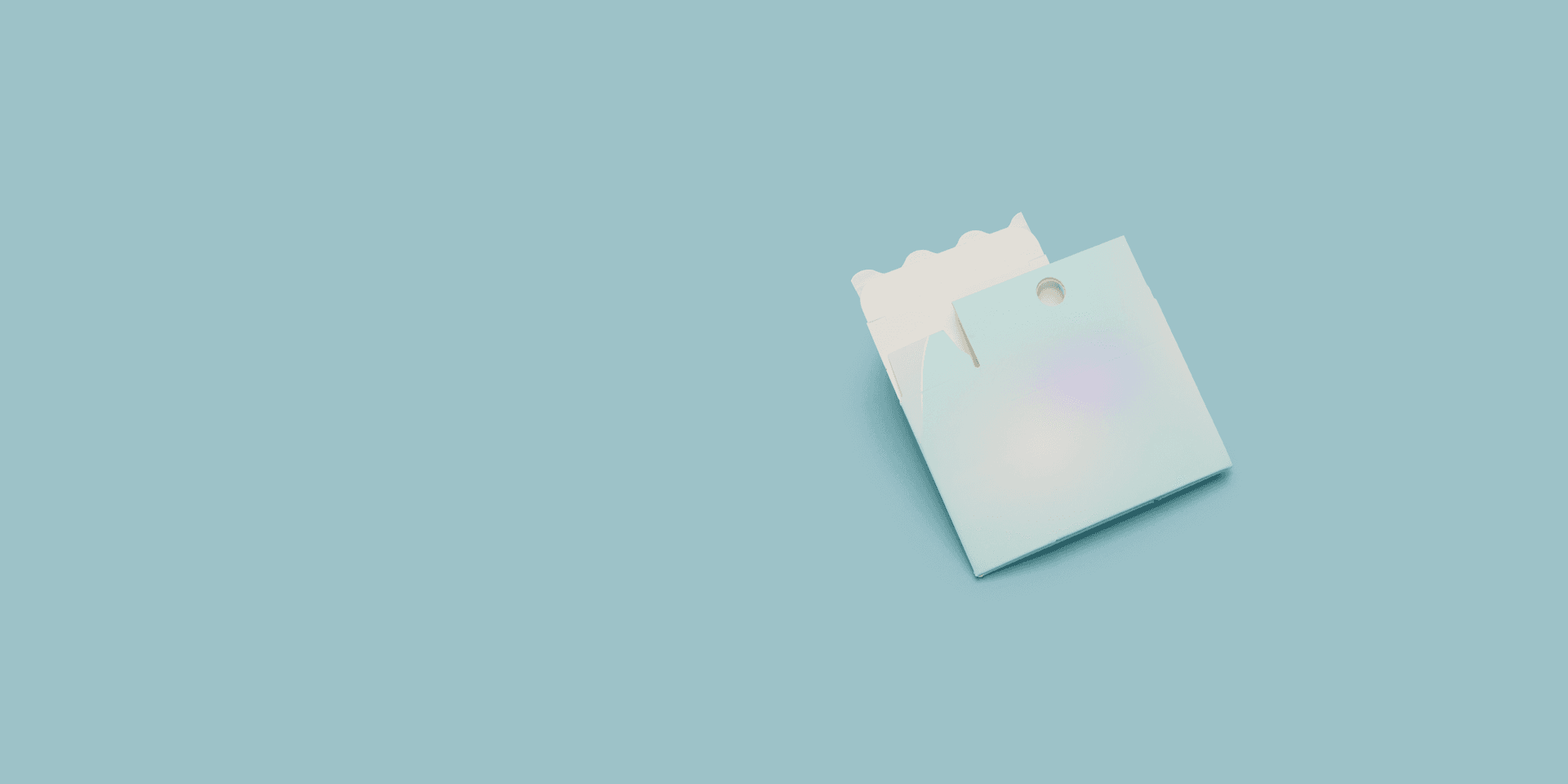 Peel N Tear vape box with iridescent finish on teal background