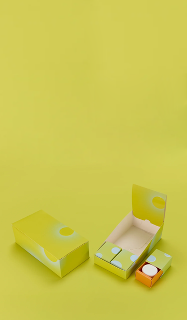 Concentrates slide box system with parent carton and individual boxes on yellow background
