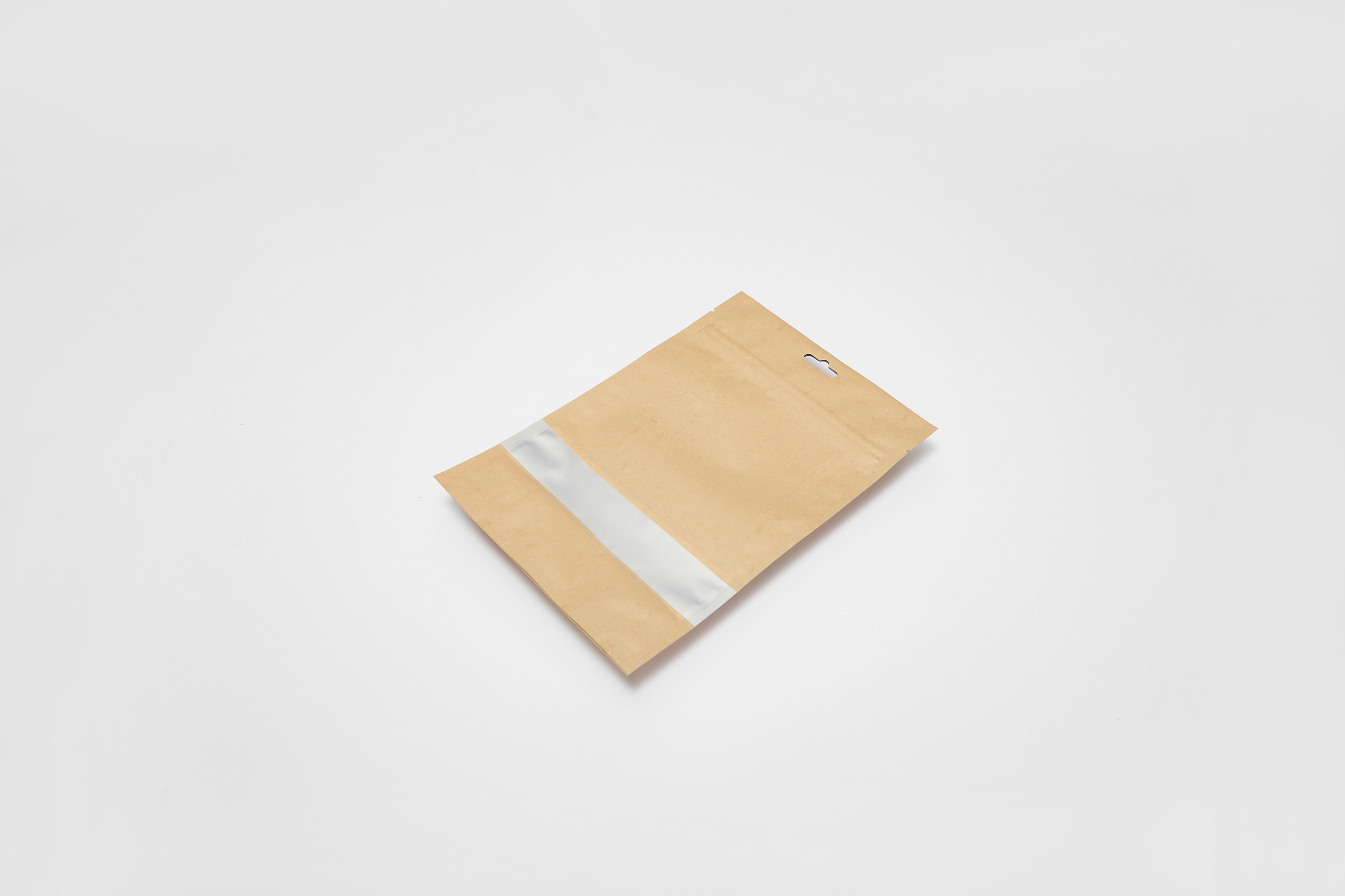 Kraft mylar bag laying flat with white strip window
